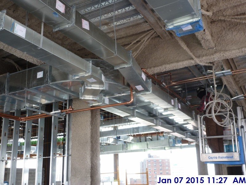 Installing copper piping at the 4th floor Facing West